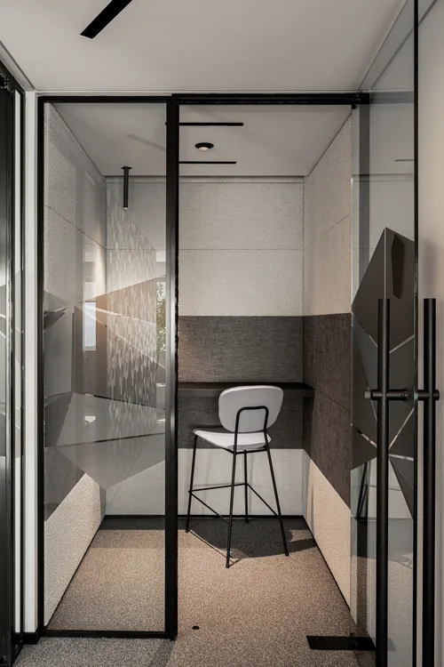 Private phone booth with glass door and acoustic panels